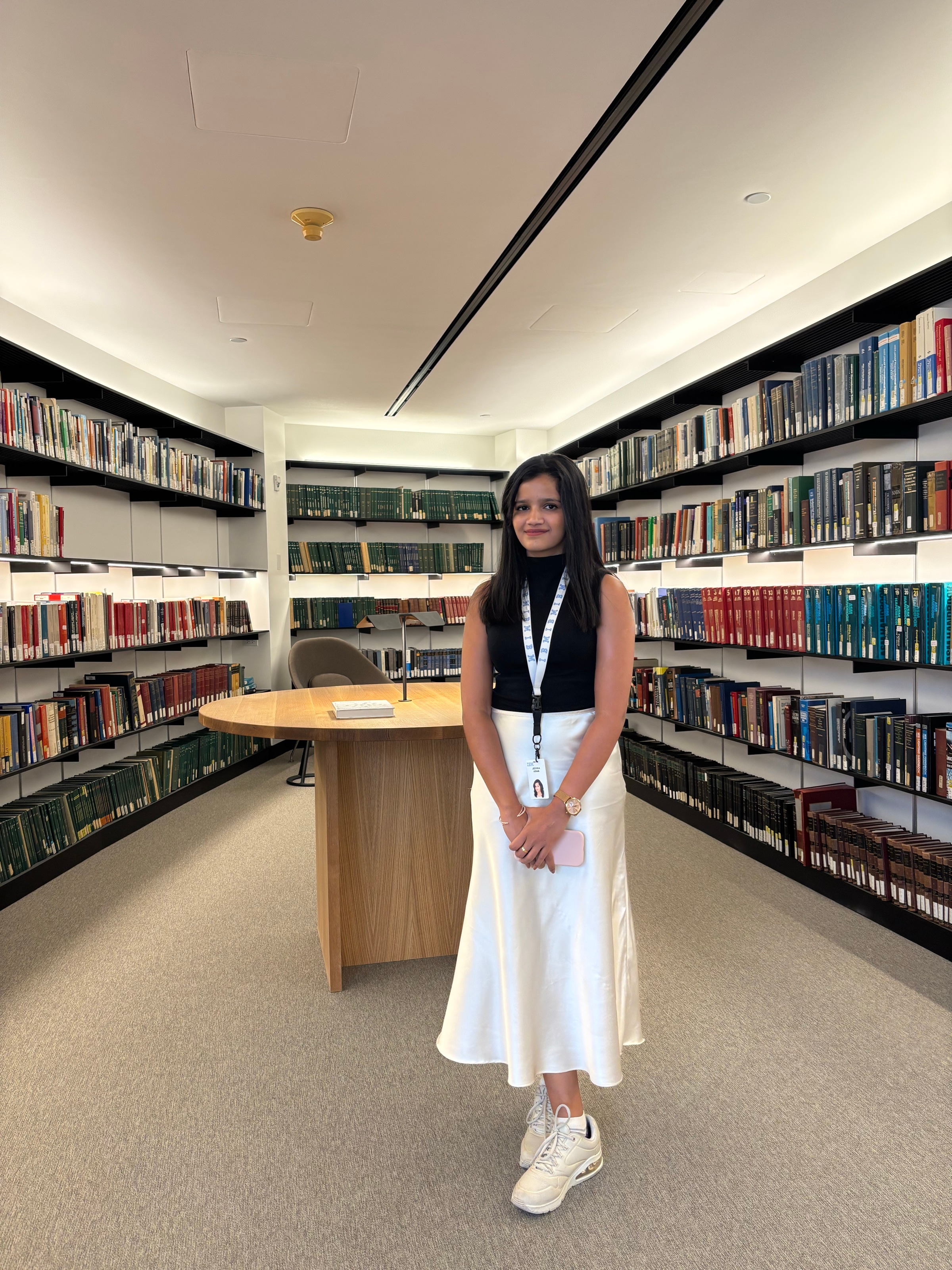 Jeevika Kiran standing in a library